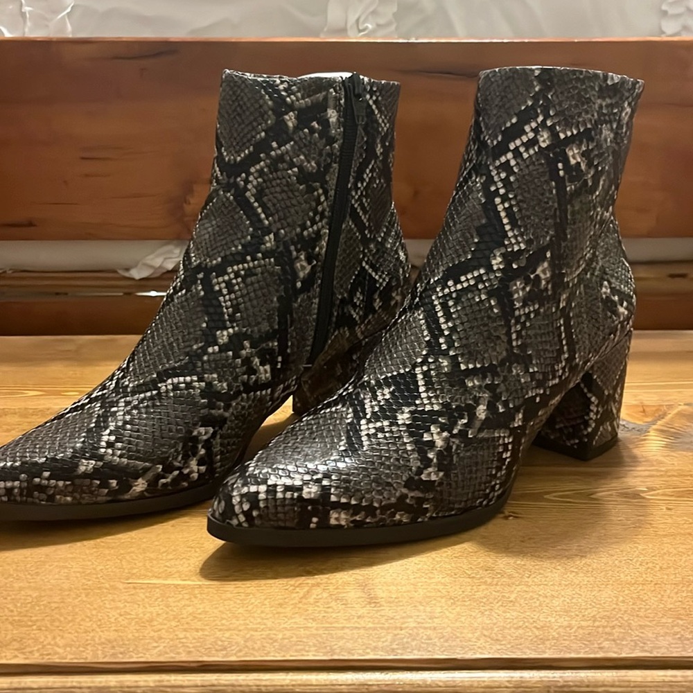 Black, gray, and white snake print boot with heel. Brand is Madden Girl. Size 9